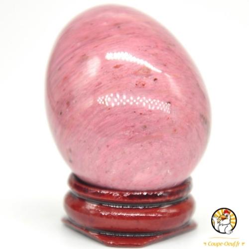 Oeuf en pierre rhodonite rose avec support à oeuf rouge